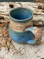 Raw clay trees and matte blue mug